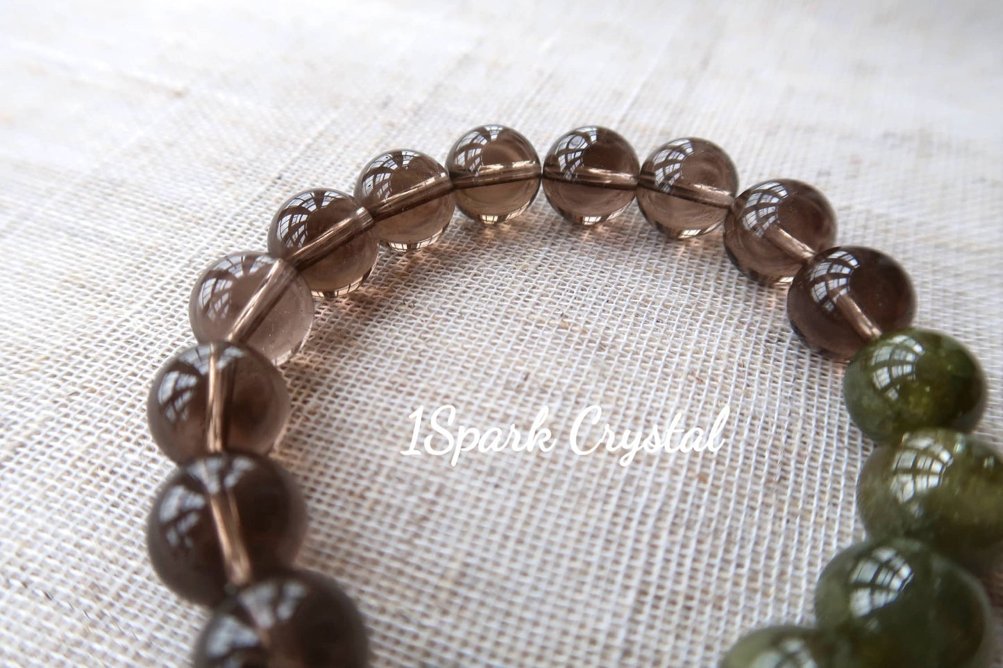 Close-up of the Healthy Glow bracelet, showing the smooth texture and natural patterns of smoky quartz, adding a touch of sophistication and balance