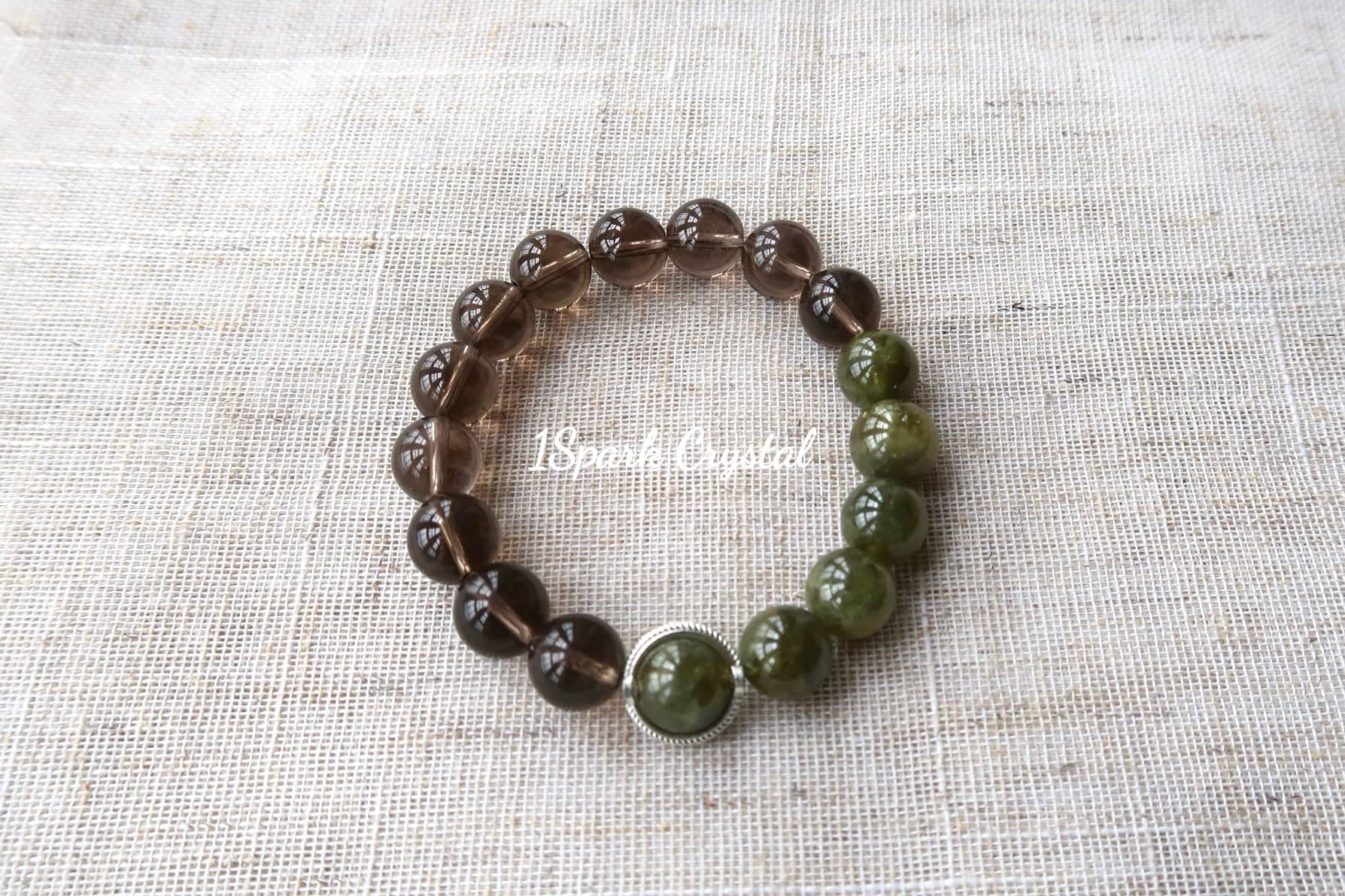 Full view of Healthy Glow bracelet with smoky quartz and tsavorite, highlighting the rich tones and glowing energy of the crystals