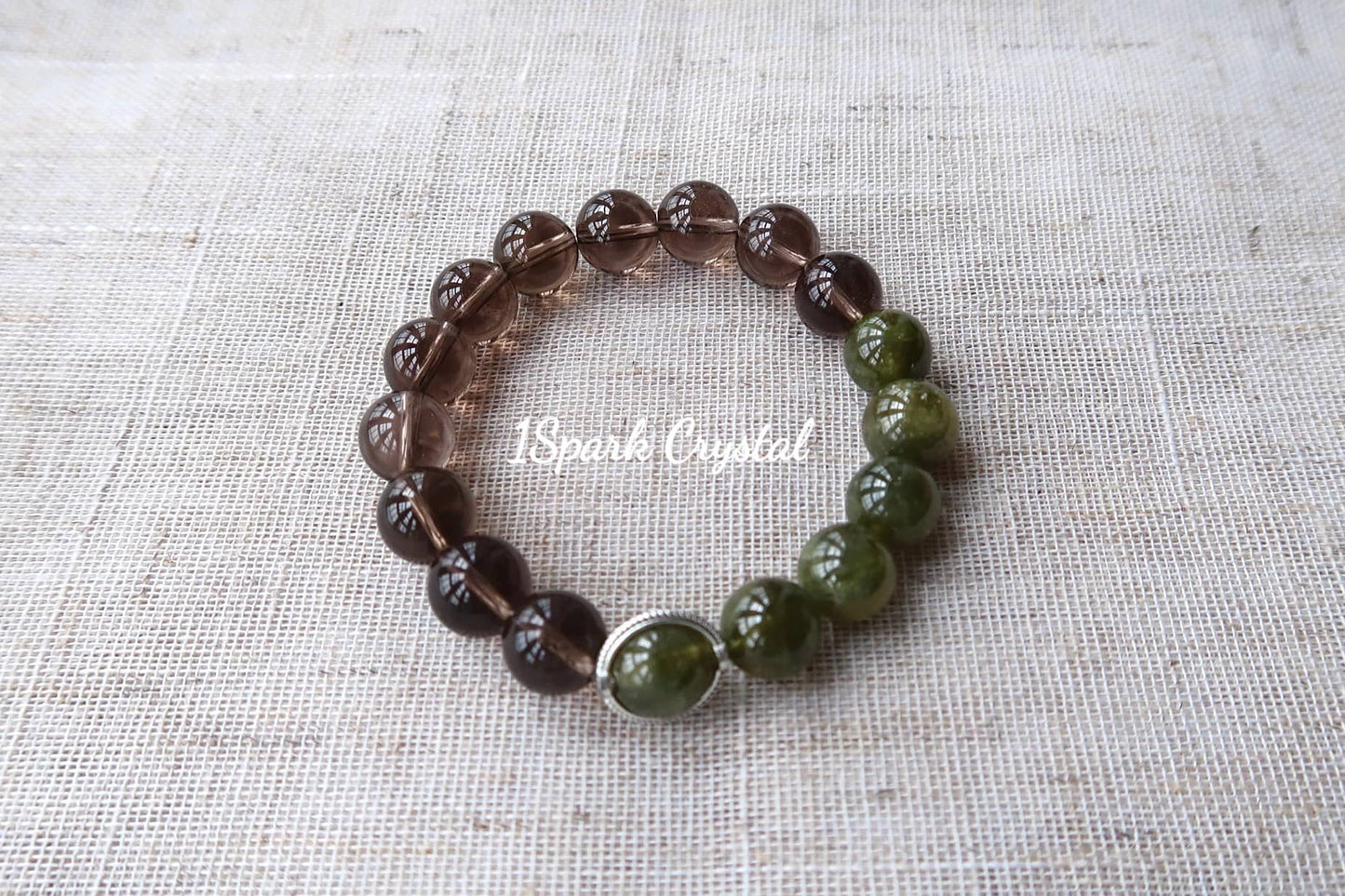 Healthy Glow handmade crystal bracelet featuring smoky quartz and tsavorite, displayed in a full view showcasing its elegant and vibrant design