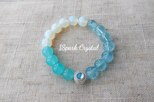 Full view of Inner Wisdom bracelet highlighting the blend of aquamarine, amazonite, and opal crystals, offering a serene and harmonious look