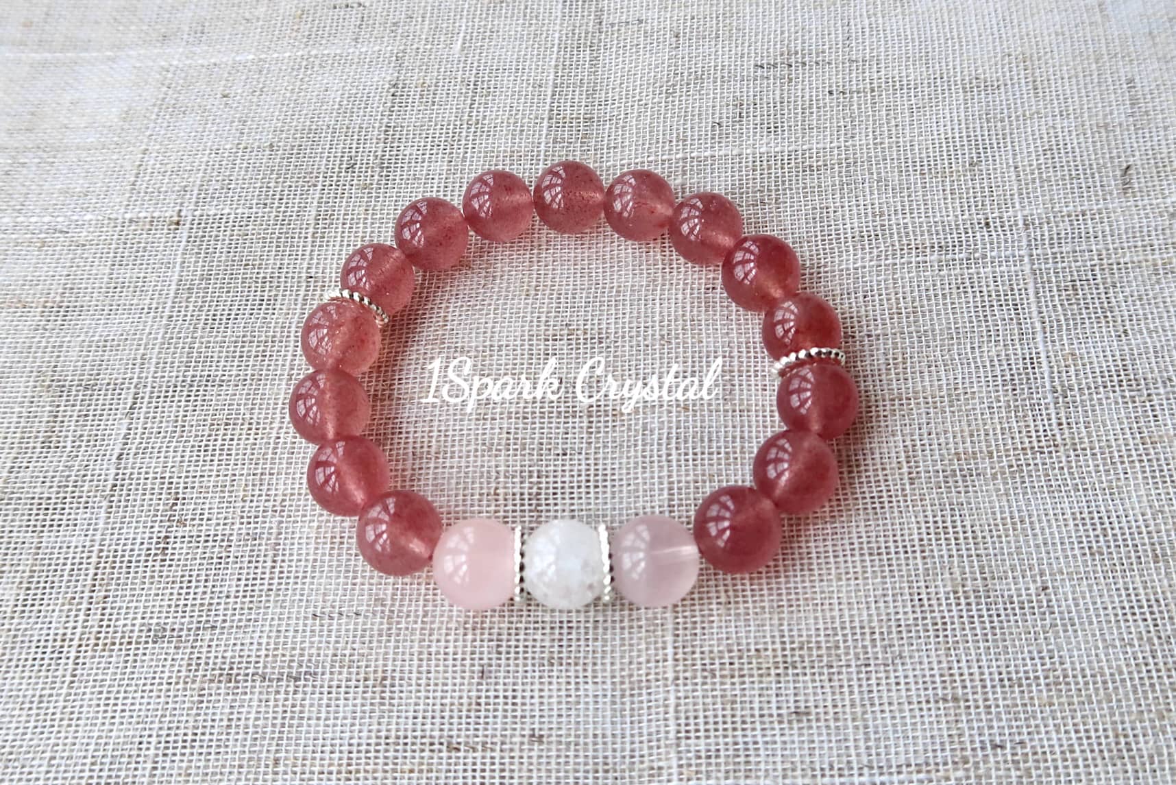 Full view of Love Manifestation bracelet featuring a mix of strawberry quartz, rose quartz, and clear quartz, capturing the bracelet’s light and vibrant energy