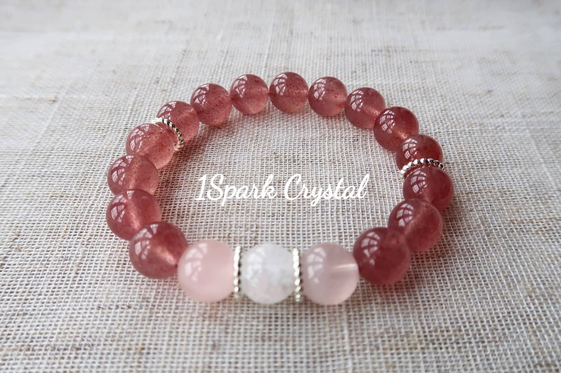 Love Manifestation handmade crystal bracelet with strawberry quartz, rose quartz, clear quartz, and silver, displayed in a beautiful full view showcasing the bracelet’s elegant design