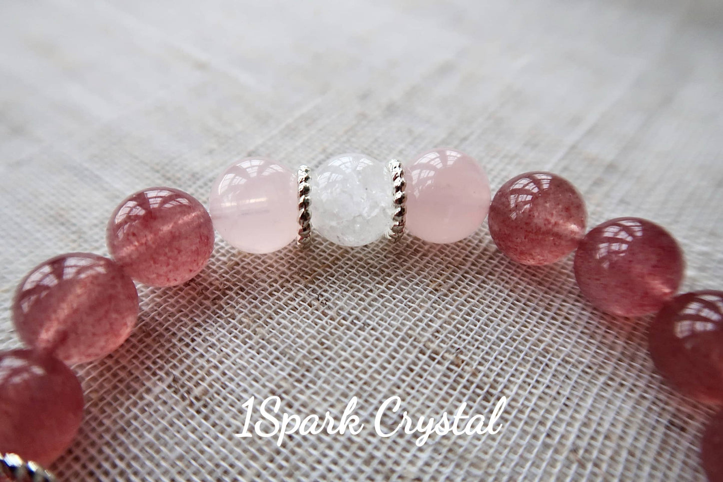 Detailed close-up of the Love Manifestation bracelet showing the delicate combination of rose quartz and clear quartz crystals with intricate silver accents