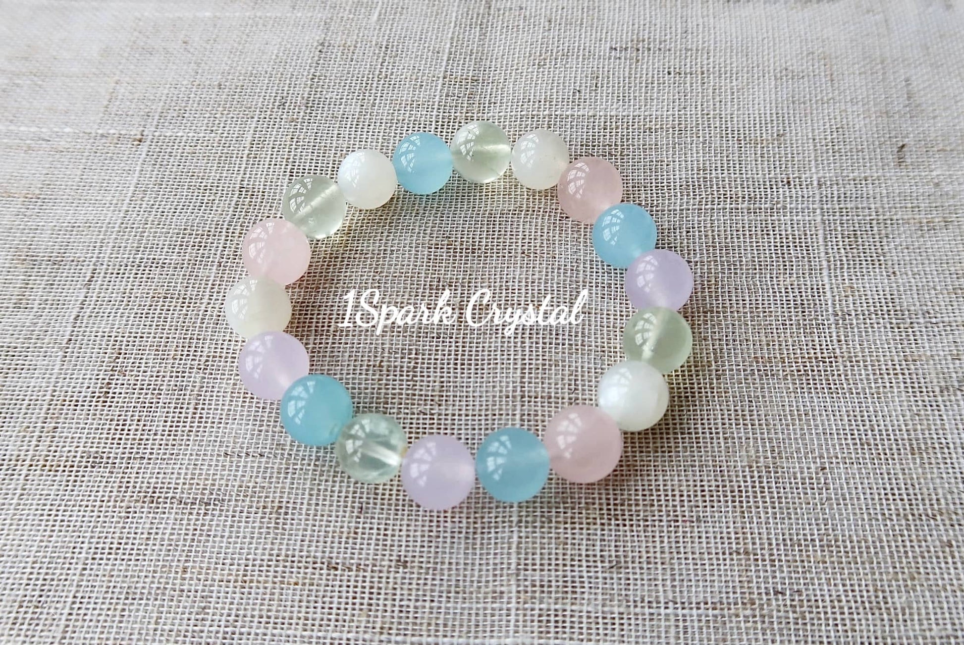 Lucky Charm handmade crystal bracelet featuring morganite, prehnite, rose quartz, and white moonstone, beautifully displayed in full view