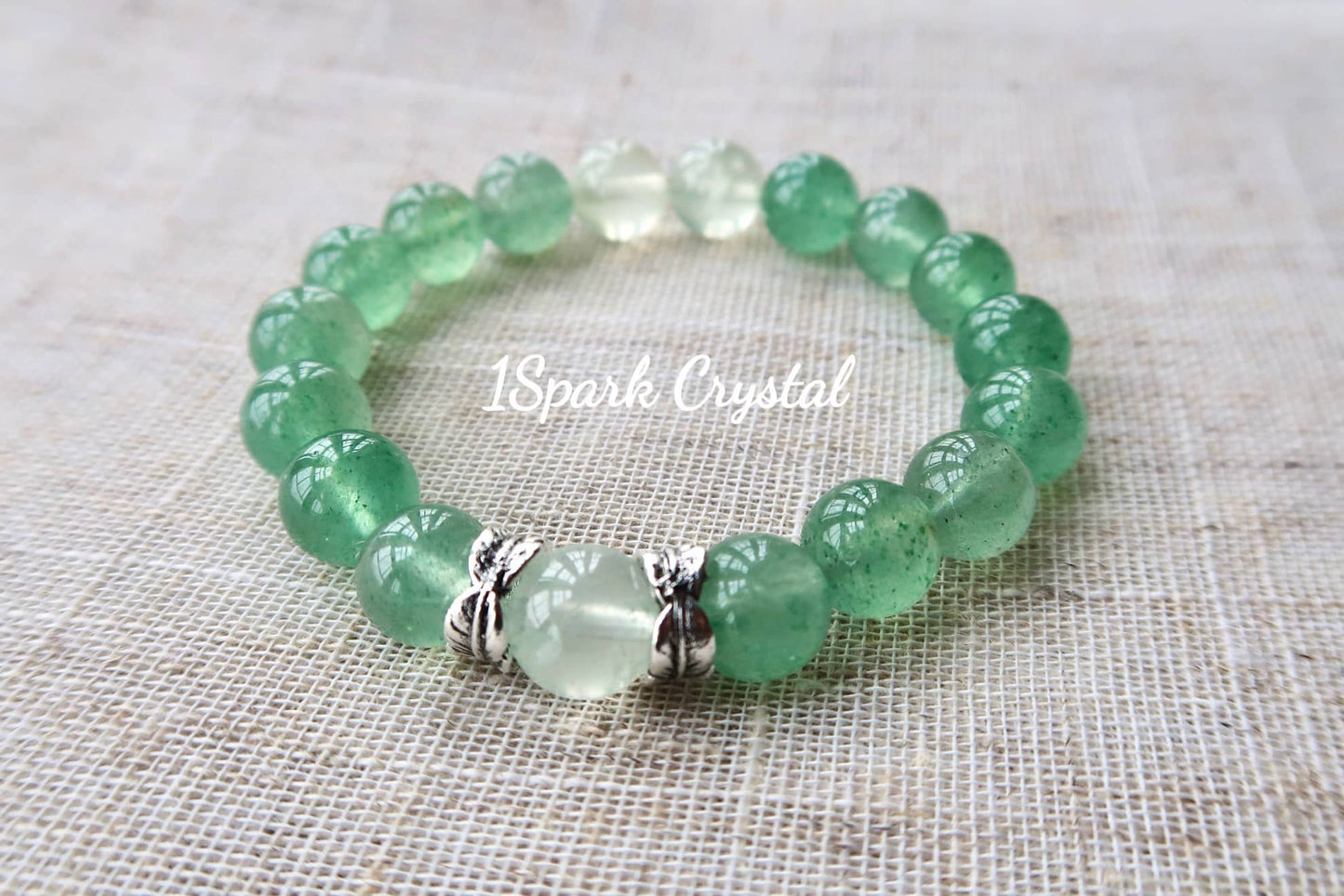 Full view of Mindful Journey bracelet, highlighting the calming green strawberry quartz and prehnite crystals, radiating a sense of inner peace and mindfulness