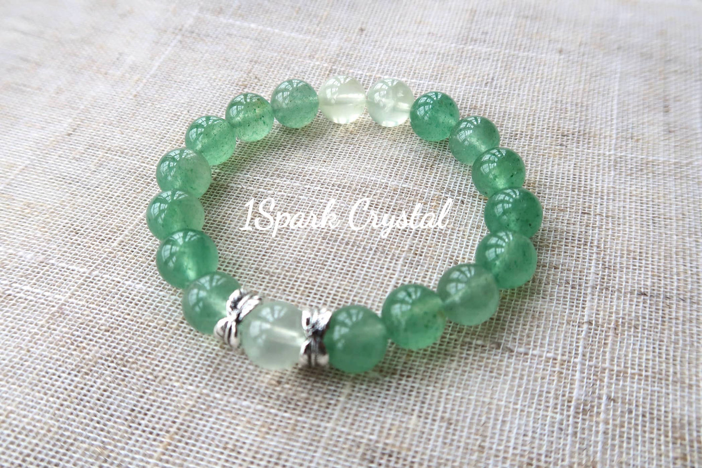 Mindful Journey handmade crystal bracelet featuring green strawberry quartz and prehnite, displayed in a full view showcasing its soothing and harmonious design