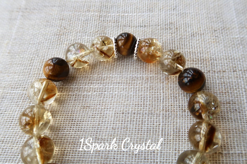 Detailed close-up of Money Magnet bracelet highlighting the golden sheen of tiger’s eye crystals, promoting strength, confidence, and financial growth
