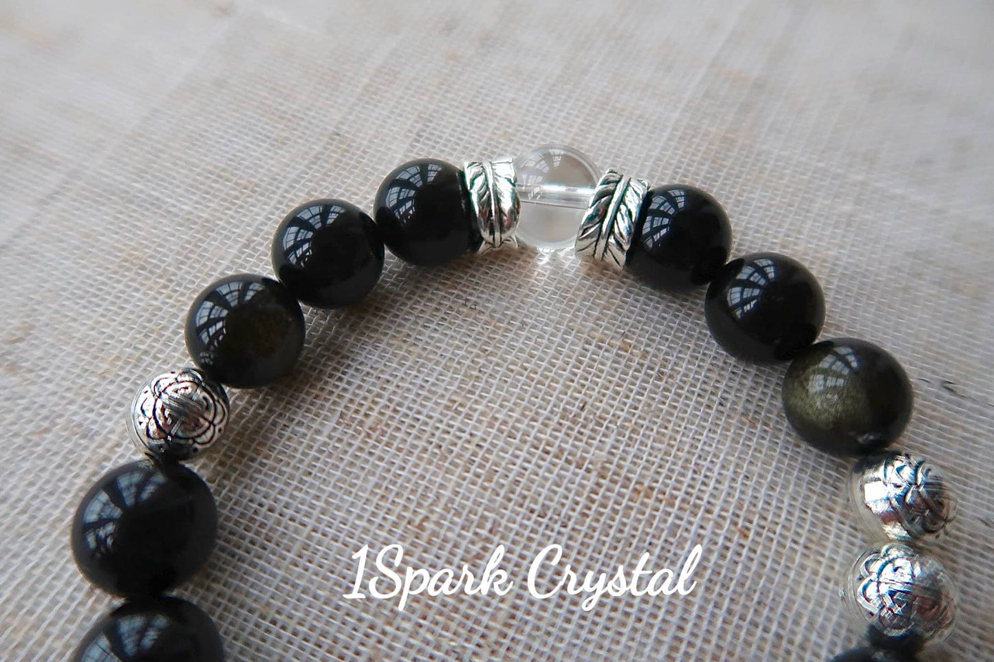 Detailed close-up of the Mystic Protection bracelet, showcasing the clarity and sparkle of black obsidian crystals, enhancing the bracelet’s protective energy