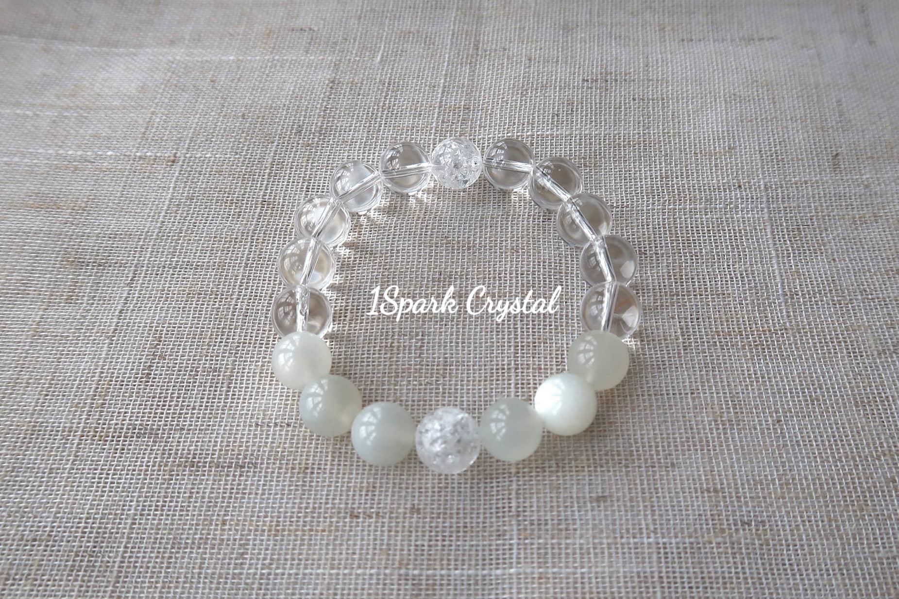 Full view of Soul Cleanse crystal bracelet featuring clear quartz and white moonstone, emphasizing the gentle glow and peaceful energy of the stones