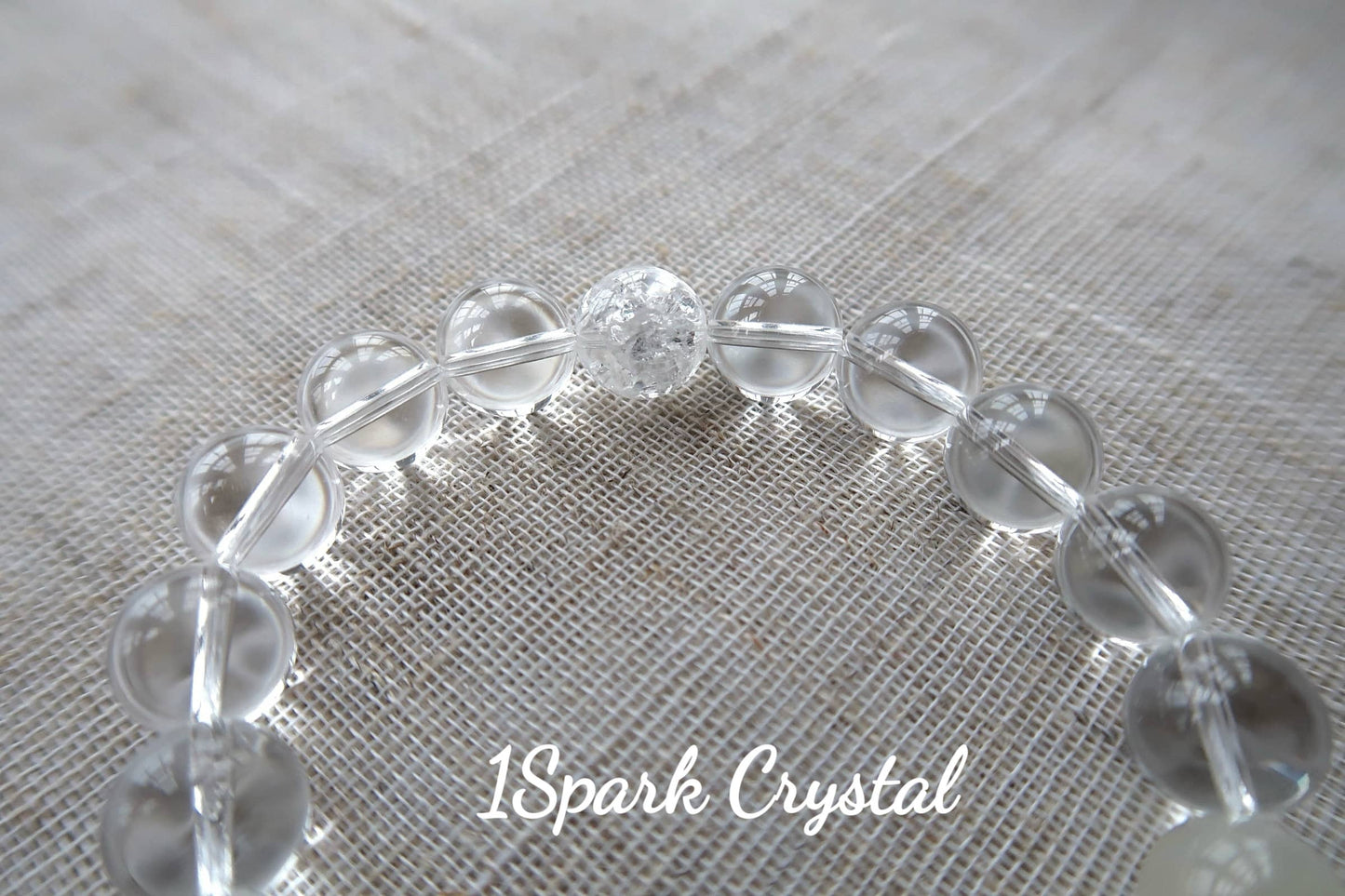 Close-up of Soul Cleanse crystal bracelet showing the smooth texture and subtle glow of clear quartz and white moonstone, emphasizing their spiritual cleansing properties