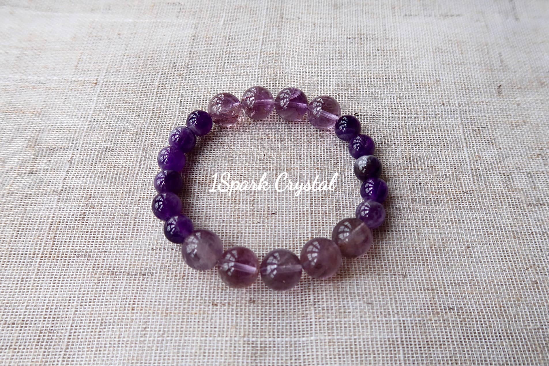 Full view of Success Path bracelet, highlighting the vibrant hues of ametrine and amethyst, symbolizing clarity, transformation, and spiritual growth