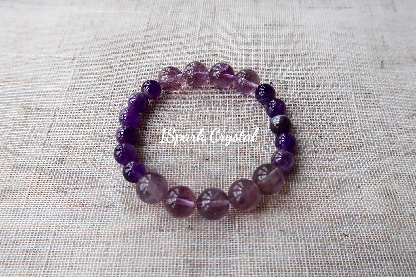 Success Path handmade crystal bracelet featuring ametrine and amethyst, displayed in a full view showcasing its bold and empowering design